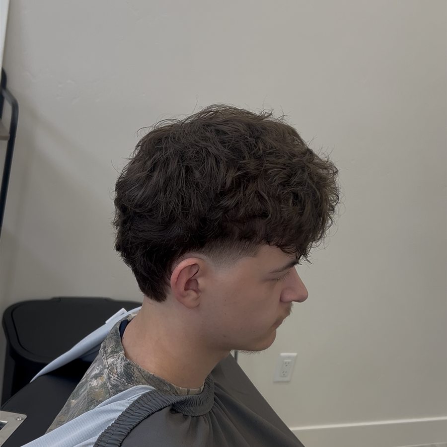 Curly haircut with tapered side, right profile