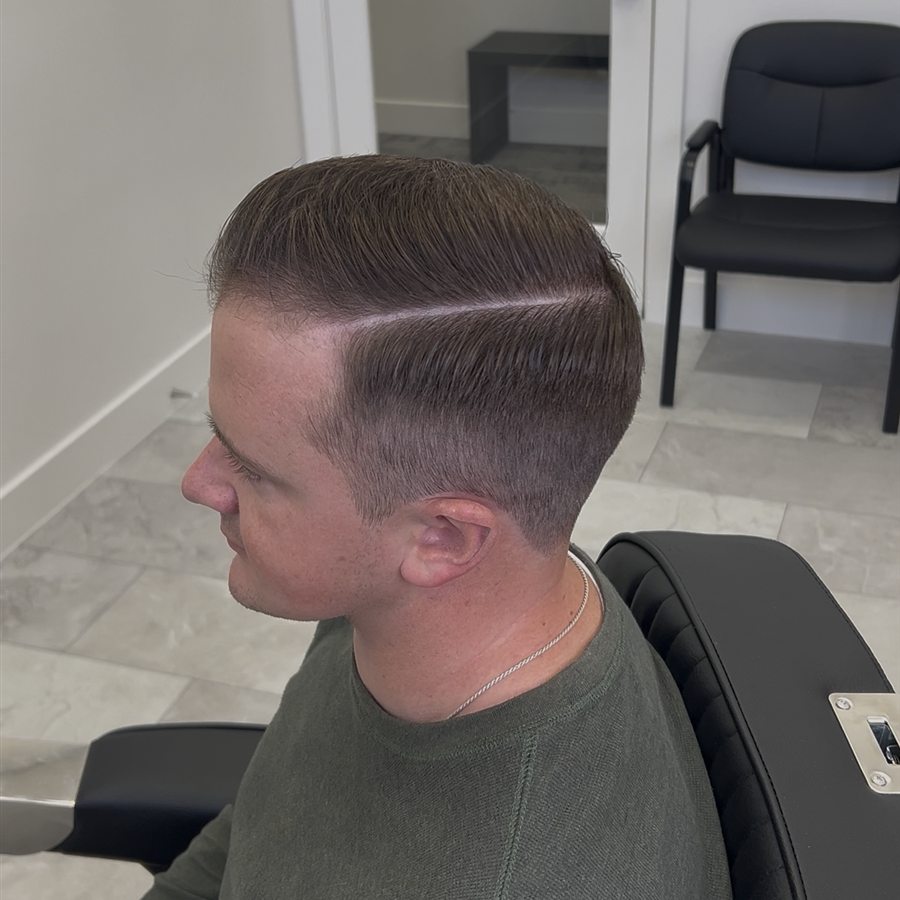 Classic side-part haircut with clean hard part